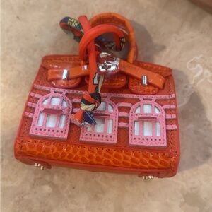 Iconic house design… Leather & 18k Gold Plated Mini Bag Charms with twilly